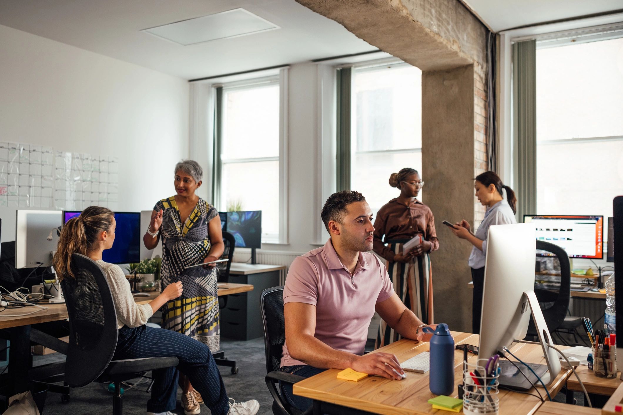 IT support team working together in a modern office