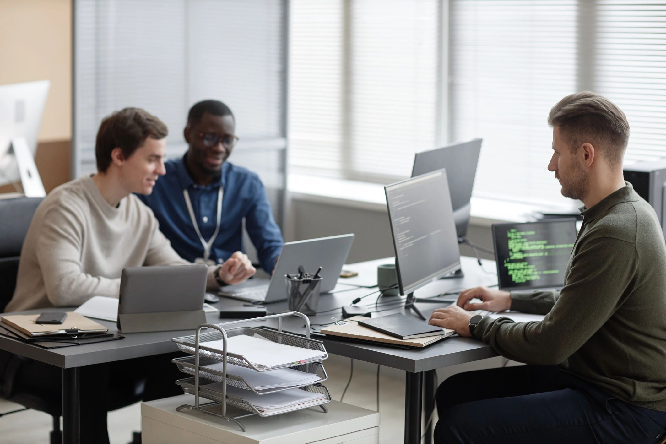 IT professionals collaborating in a cybersecurity office